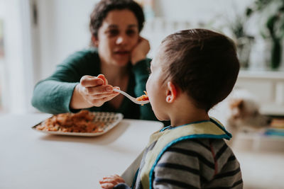 Portrait of boy eating food