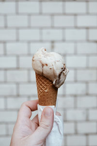 Hand holding ice cream cone