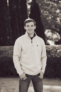 Portrait of young man standing outdoors