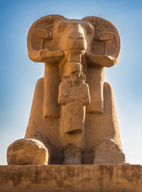 Low angle view of statue against sky