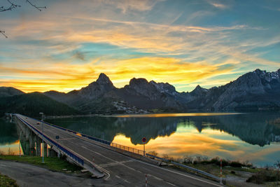Scenic view of lake against sky during sunset