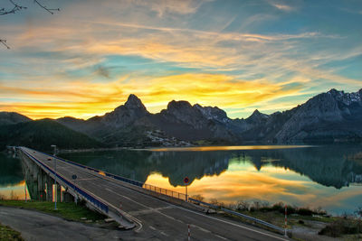 Scenic view of lake against sky during sunset