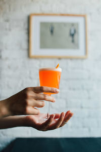 Close-up of woman holding drink