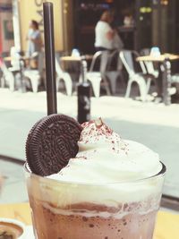 Close-up of ice cream on table at cafe