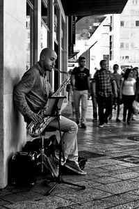 Street musician playing saxophone