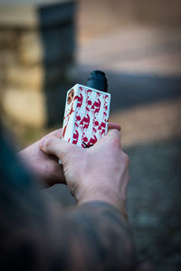 Close-up of person holding hands