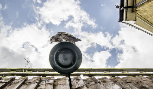 Low angle view of roof against sky