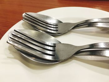 High angle view of silverware on plate