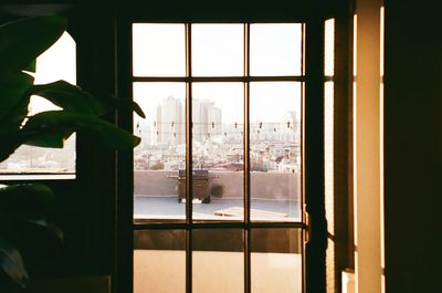 View of trees seen through window during winter