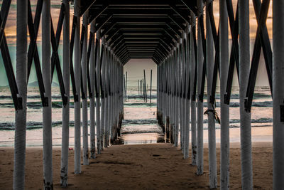 Footpath amidst buildings at beach