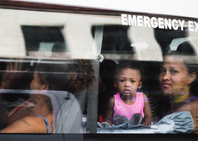 Reflection of two people in mirror