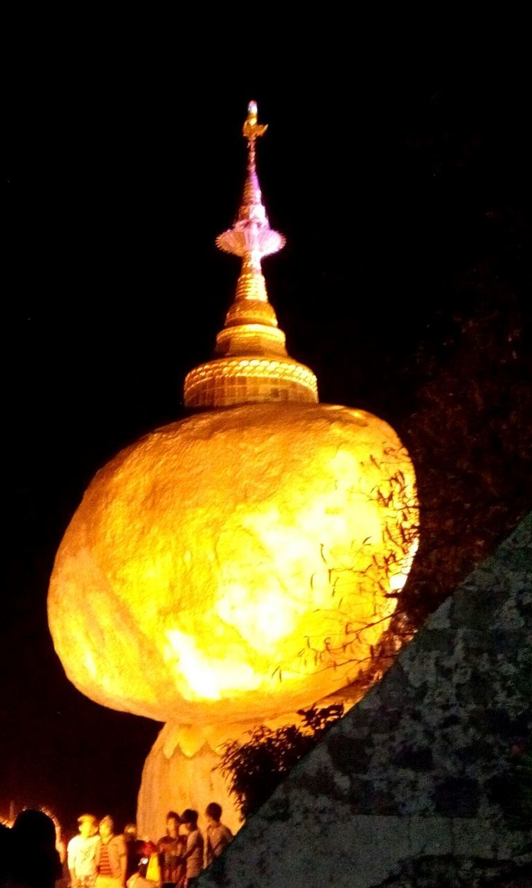 illuminated, night, religion, spirituality, low angle view, gold colored, place of worship, glowing, lighting equipment, close-up, copy space, buddha, famous place, temple - building, dark, lit, no people, cultures, light - natural phenomenon