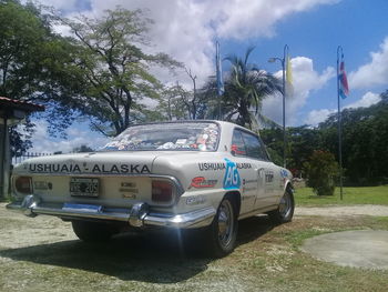 Cars on road against sky