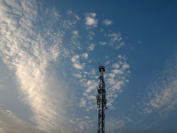 Low angle view of communications tower against sky