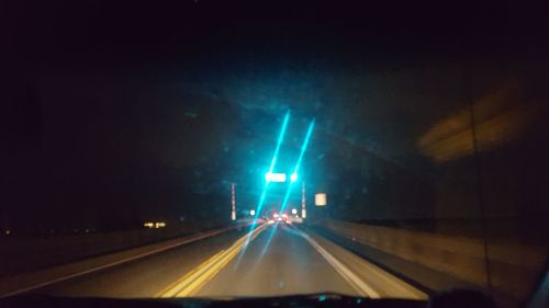 Car moving on road at night