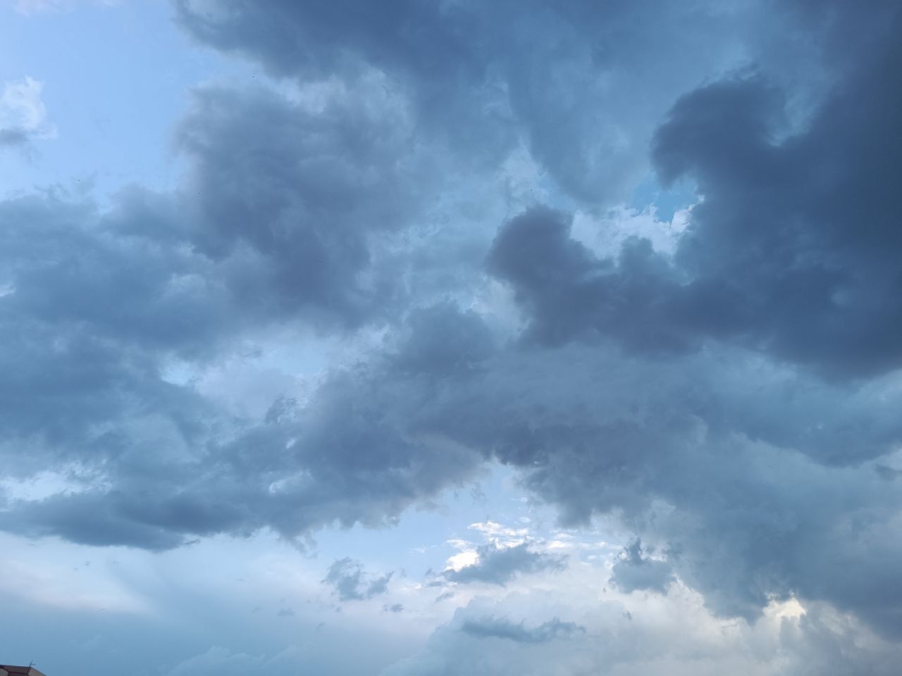 sky, cloud, environment, storm, nature, beauty in nature, dramatic sky, cloudscape, thunderstorm, storm cloud, scenics - nature, blue, no people, overcast, outdoors, daytime, rain, landscape, wet, moody sky, backgrounds, meteorology, dark, wind, sunlight, horizon, ominous, awe, day, mountain, atmosphere, copy space