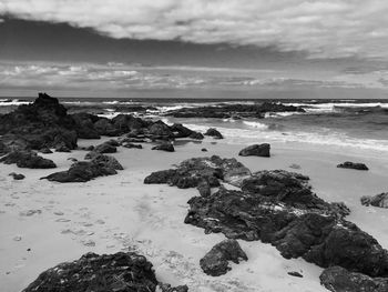 Scenic view of sea against cloudy sky