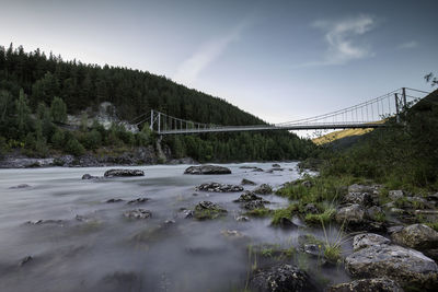 Bridge over river against sky