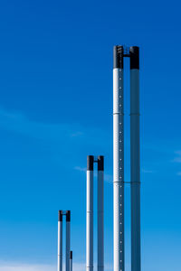 Tall chimneys blue sky and white clouds