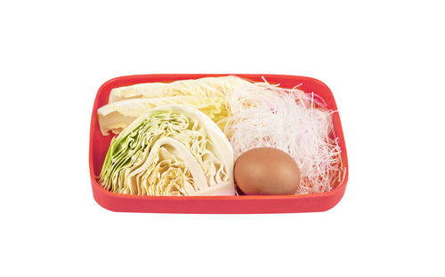 High angle view of bread in container against white background