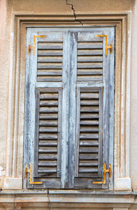 Low angle view of window of old building