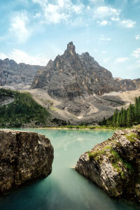 Scenic view of lake and mountains against sky