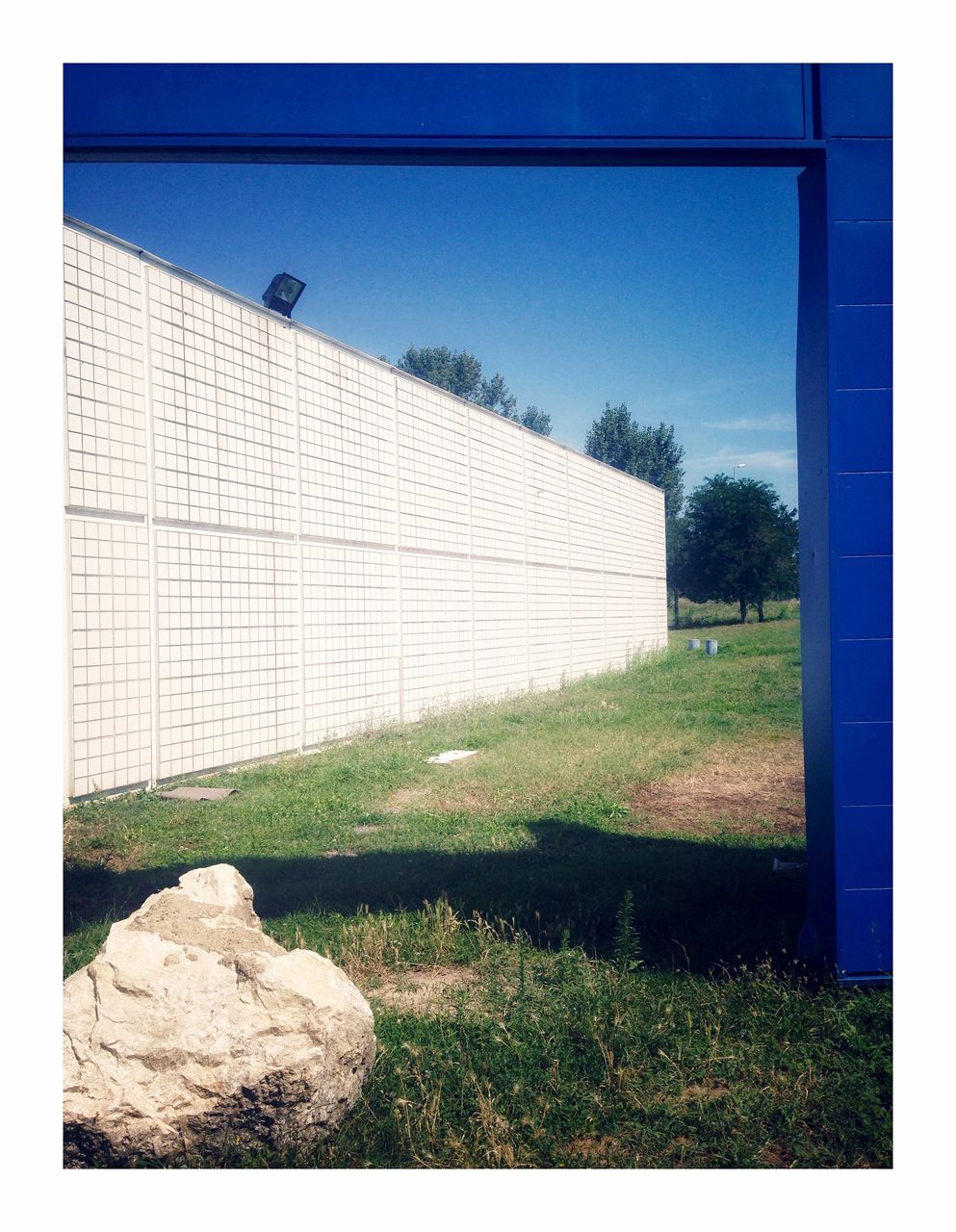 grass, plant, architecture, auto post production filter, transfer print, nature, built structure, building exterior, day, no people, sky, field, building, clear sky, outdoors, land, blue, tree, copy space, rock