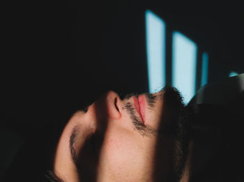 Close-up portrait of a young man sleeping