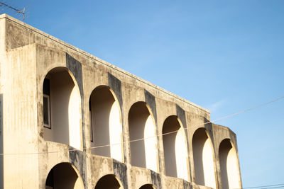 Low angle view of arch bridge against clear sky