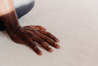 Low section of woman sitting on floor