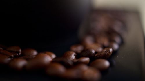 Close-up of coffee beans on table