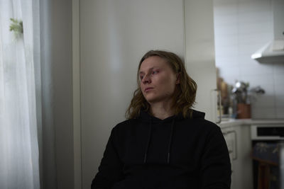 Sad woman sitting at table