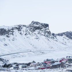 Scenic view of snowcapped mountains against clear sky