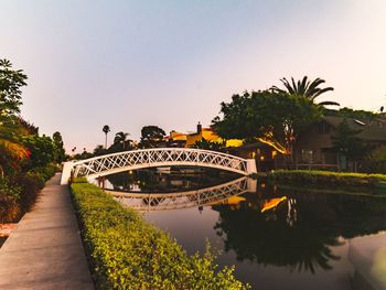 Bridge over river against clear sky