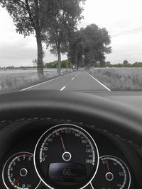 Close-up of dashboard from car windshield