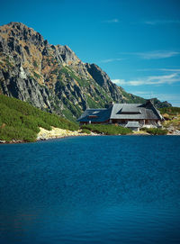 View of calm lake in front of mountain range