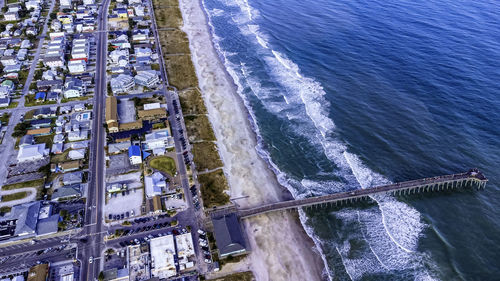 High angle view of sea seen through railing