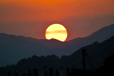 Scenic view of mountains against sky during sunset