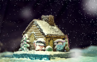 Snow on field against sky at night