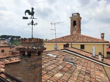 Exterior of buildings in city against sky