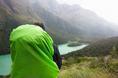 Rear view of woman looking at mountains