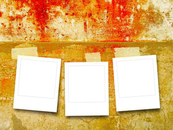 Low angle view of paper on wall