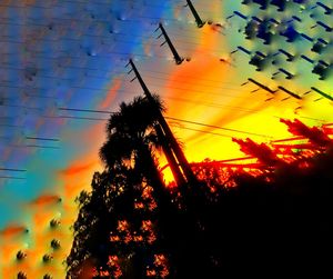 Low angle view of silhouette trees against sky during sunset