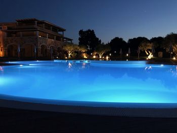 View of swimming pool at night