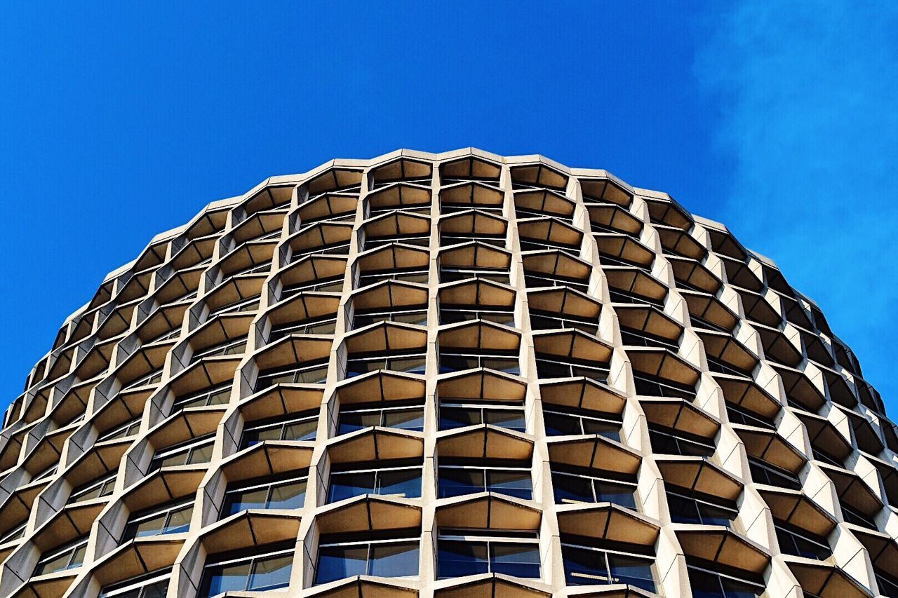 LOW ANGLE VIEW OF BUILDING AGAINST CLEAR BLUE SKY