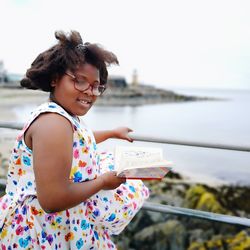 Portrait of a girl holding book