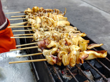 High angle view of meat on barbecue grill