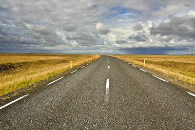 Empty road along landscape