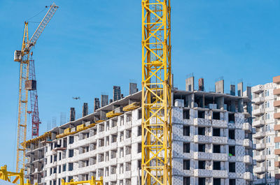 Low angle view of buildings against clear blue sky