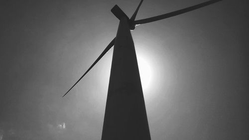 Low angle view of windmill against sky